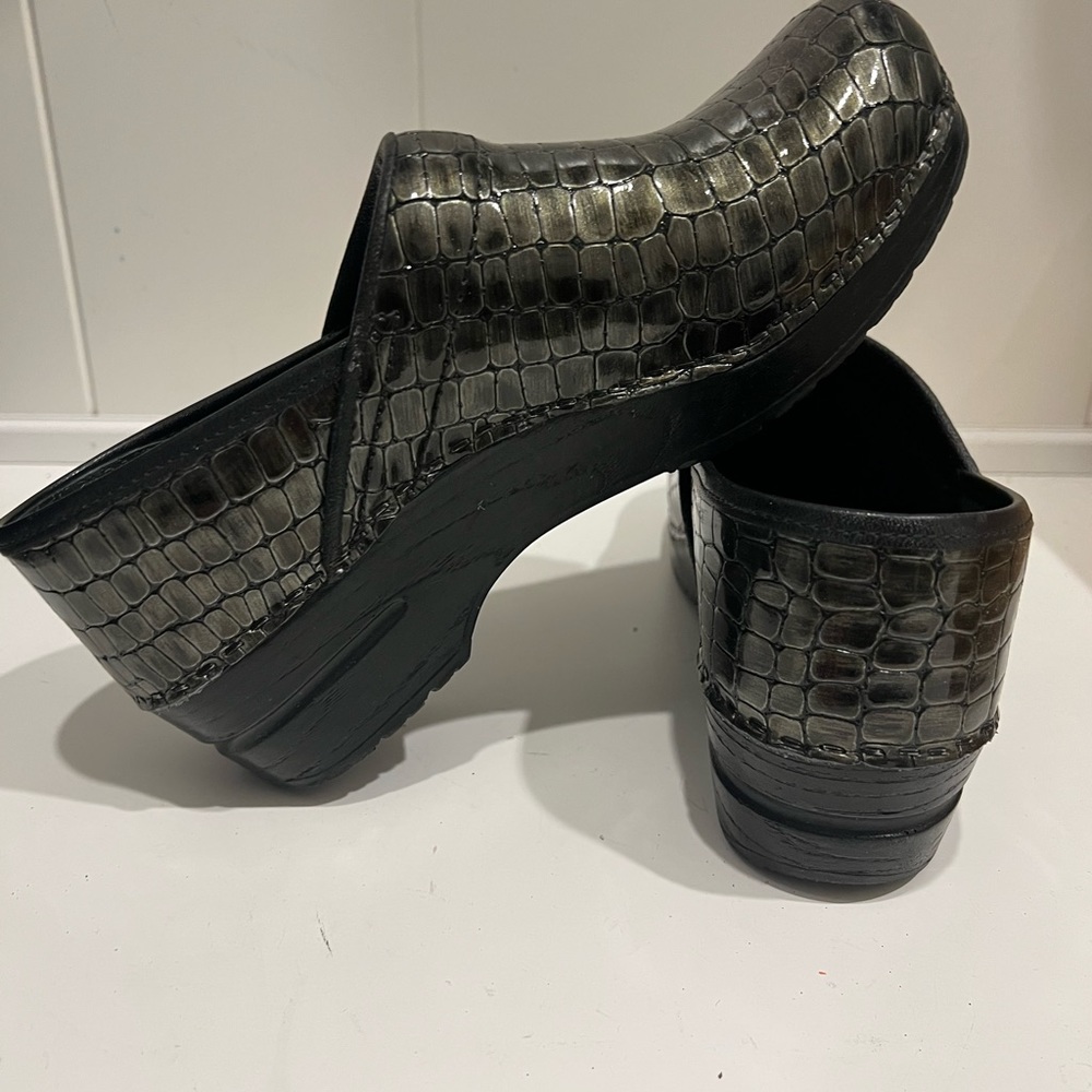 Sanita lizard print clogs.